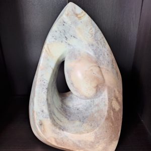 Woman Looking into a Cave